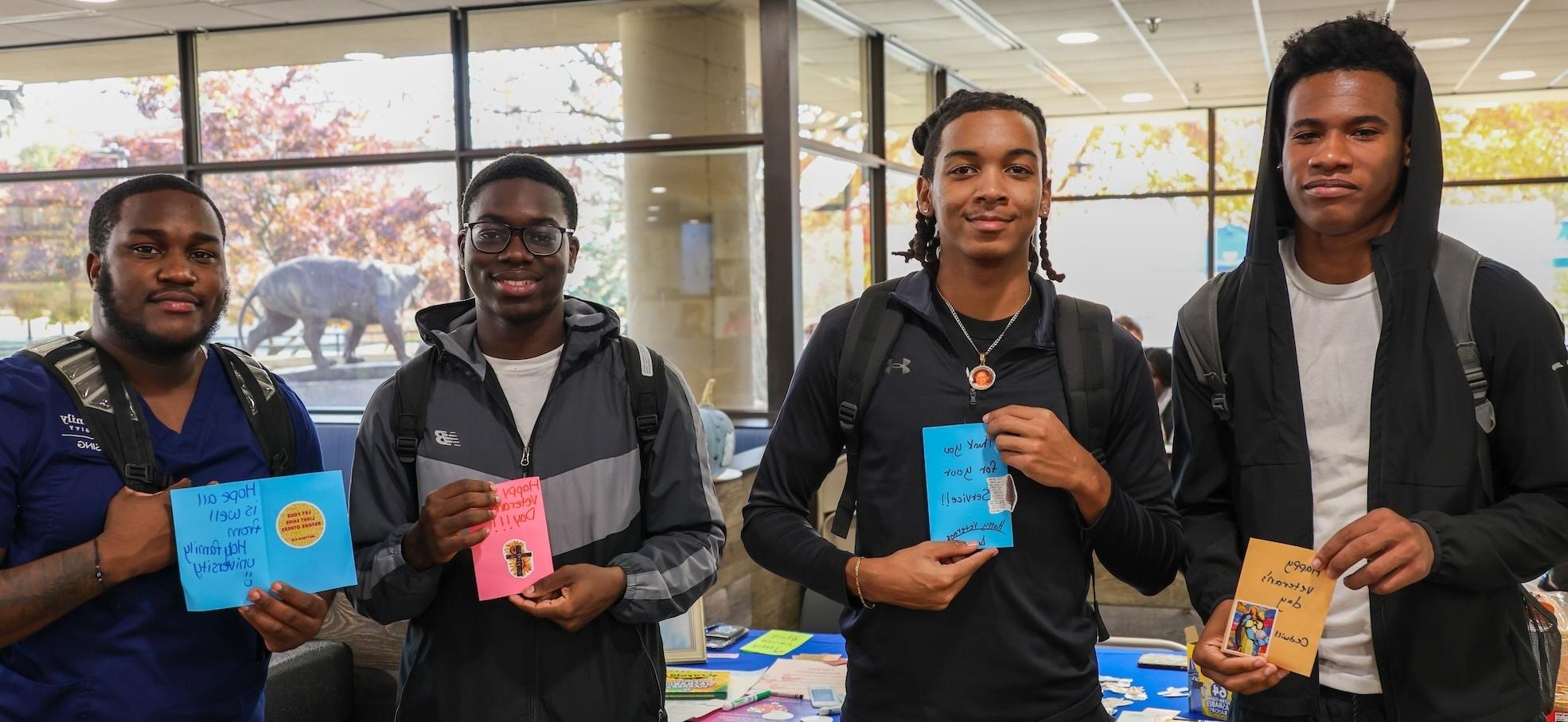 Four Holy Family University students at the campus ministry event